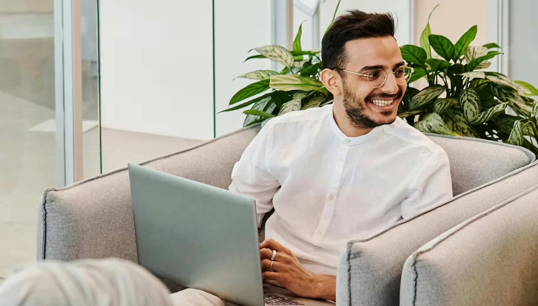 Best auditors in UAE: business owner comparing audit firm options on a laptop