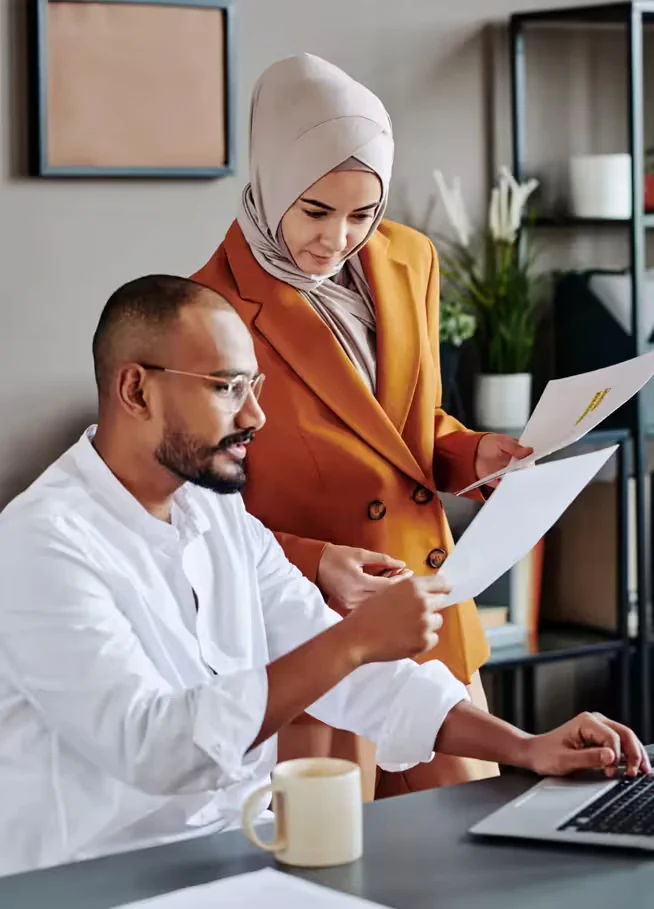 External audit services in the UAE: audit team reviewing financial documents on a laptop