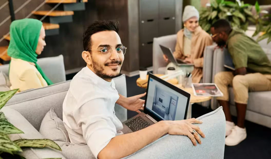 SGA World accountants and auditors working with clients in a modern office