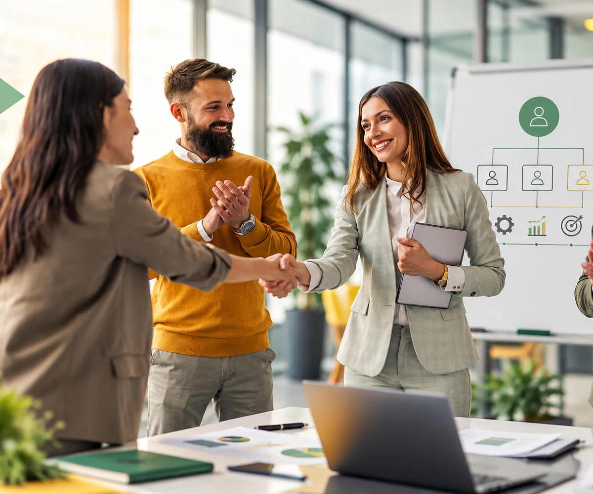 M&A advisory in the UAE: buyer and seller teams shaking hands after agreeing a transaction