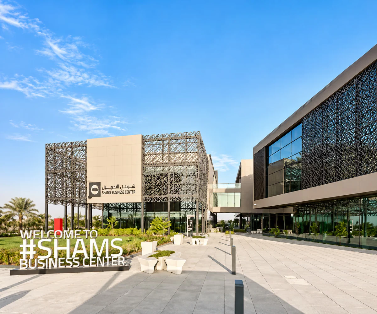 Sharjah Media City (SHAMS): the SHAMS Business Center building and welcome sign in Sharjah